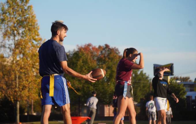 Students playing flag football.