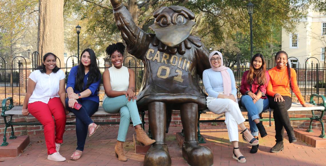 students with cocky statue