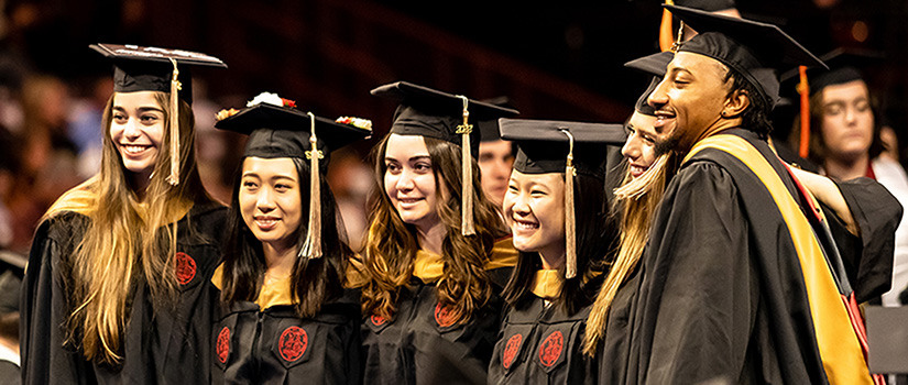 graduates at commencement