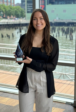 Nicole Palmer holding an award