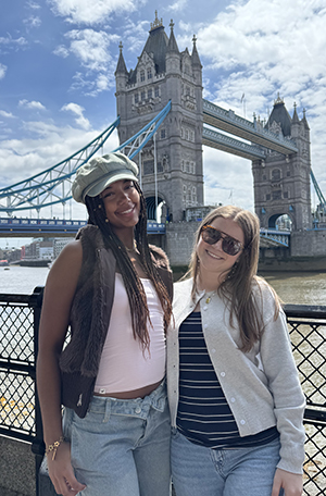 Bailey Champion and Sydney Thompson posing on the Tower Bridge in London