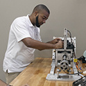 student uses lab equipment