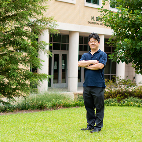 Jianjan Hu in front of the Storey Building