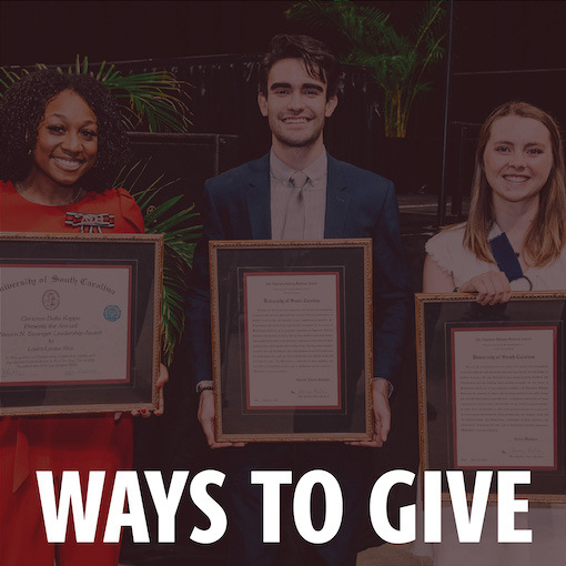 2022 UofSC Honors award winners holding their awards