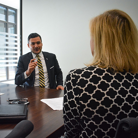 Student interacting with employer during interview