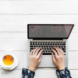 Someone typing on a computer