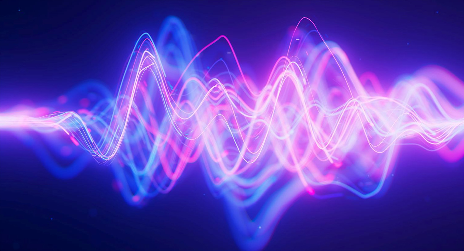 Neon pink and purple waves on black background depict how particles at the quantum level behave.