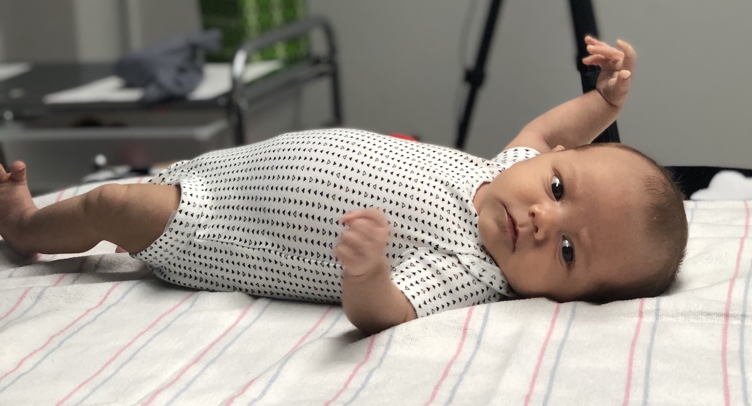 Newborn baby in crib