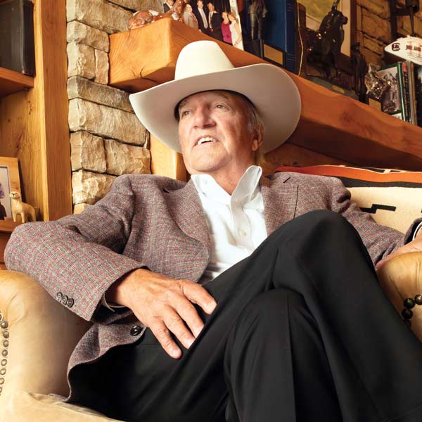 Joe Rice in his office with an off-white cowboy hat atop his head