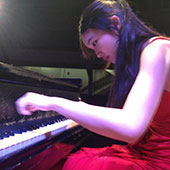 Susan Zhang playing a piano